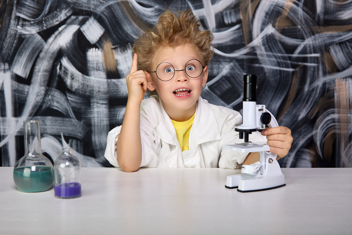 Cute boy in professor's bathrobe and glasses suddenly came up with amazing idea
